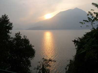 The sun sets across Lake Como