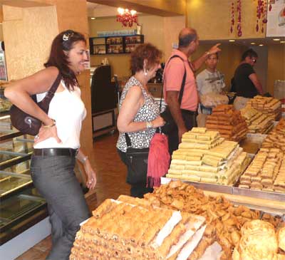 Sara, Carol and Shlomo in a sweet shop in Jaffa