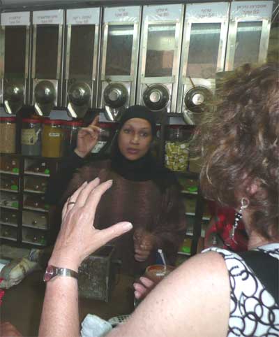 Carol buying coffee in Jaffa