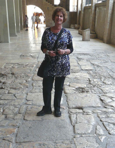 Carol standing on stones that are thousands of years old in Jerusalem