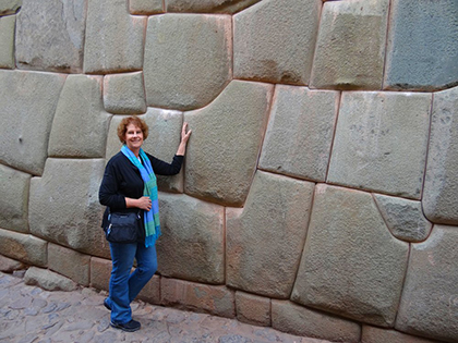 Carol at an ancient Incan stone wall in Cuzco