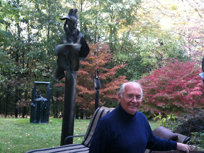 Bruce Fink, the artist, with some of his works in his back yard