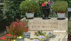 Simone Signoret and Yves Montand rest at Pere Lachaise